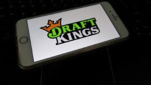 DraftKings (DKNG) logo on a phone
